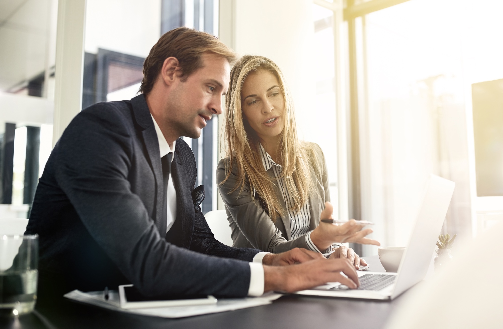 Plotting the course of their business. Shot of a two executives working together in an office.